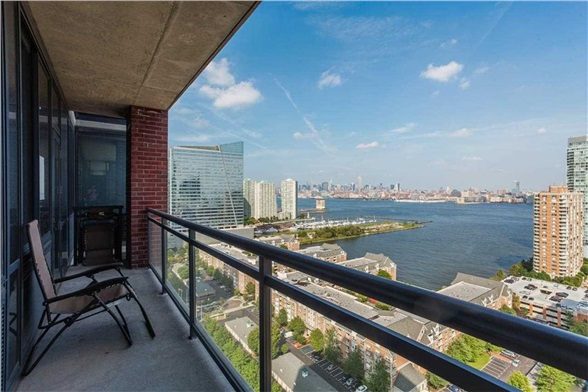 389 Washington St Apt 27G Jersey City NJ - balcony view of Manhattan skyline and Hudson River
